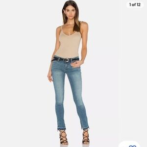 Free people low rise side slit raw hem skinny jeans. Size 30